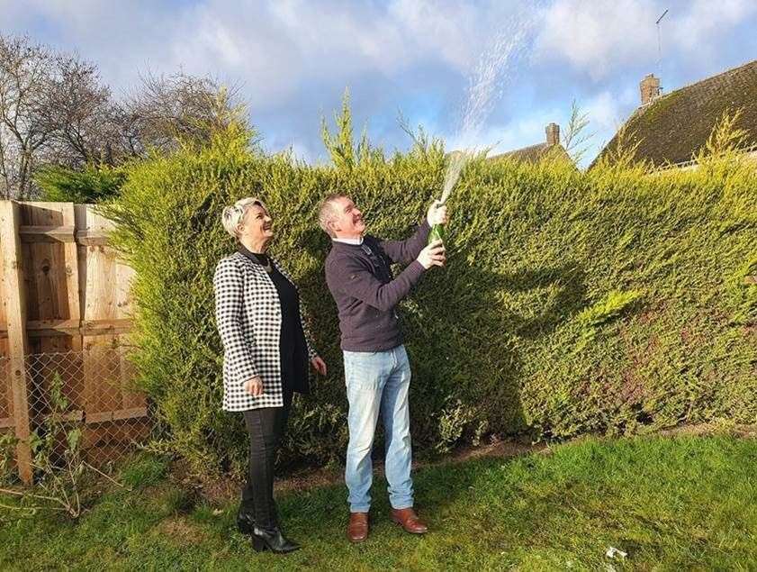 Martin Gilbey and his partner Tracy celebrating a £119,000 EuroMillions win (Camelot/PA)