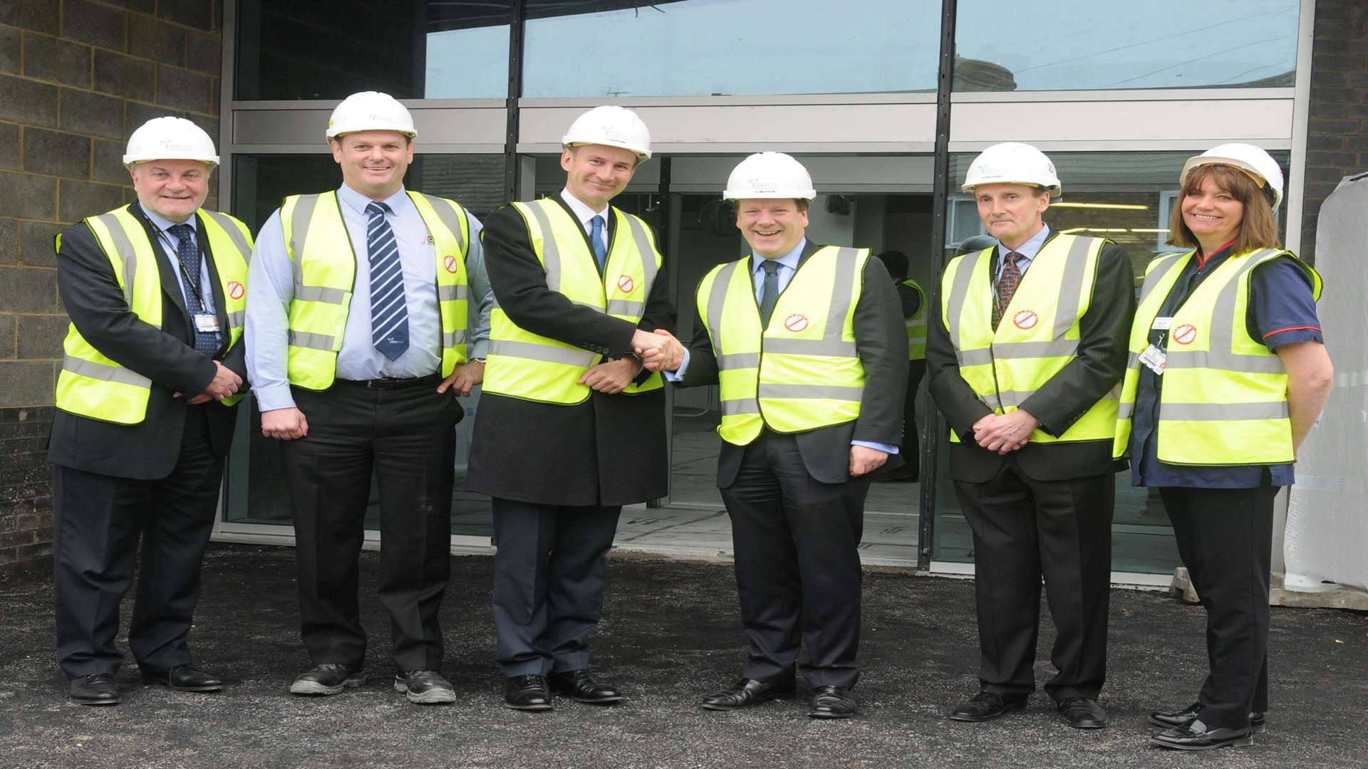 Health Secretary Jeremy Hunt (middle left) and MP Charlie Elphicke (middle right) were given a tour of the building
