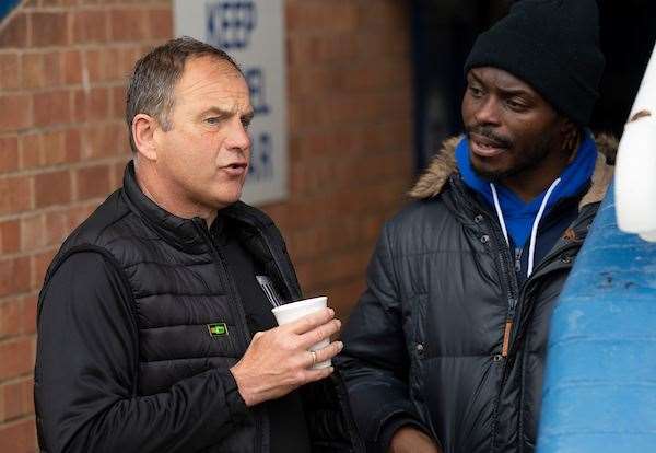 Gillingham boss Steve Lovell chats to injured captain Gabriel Zakuani at Peterborough Picture: Ady Kerry (8318365)
