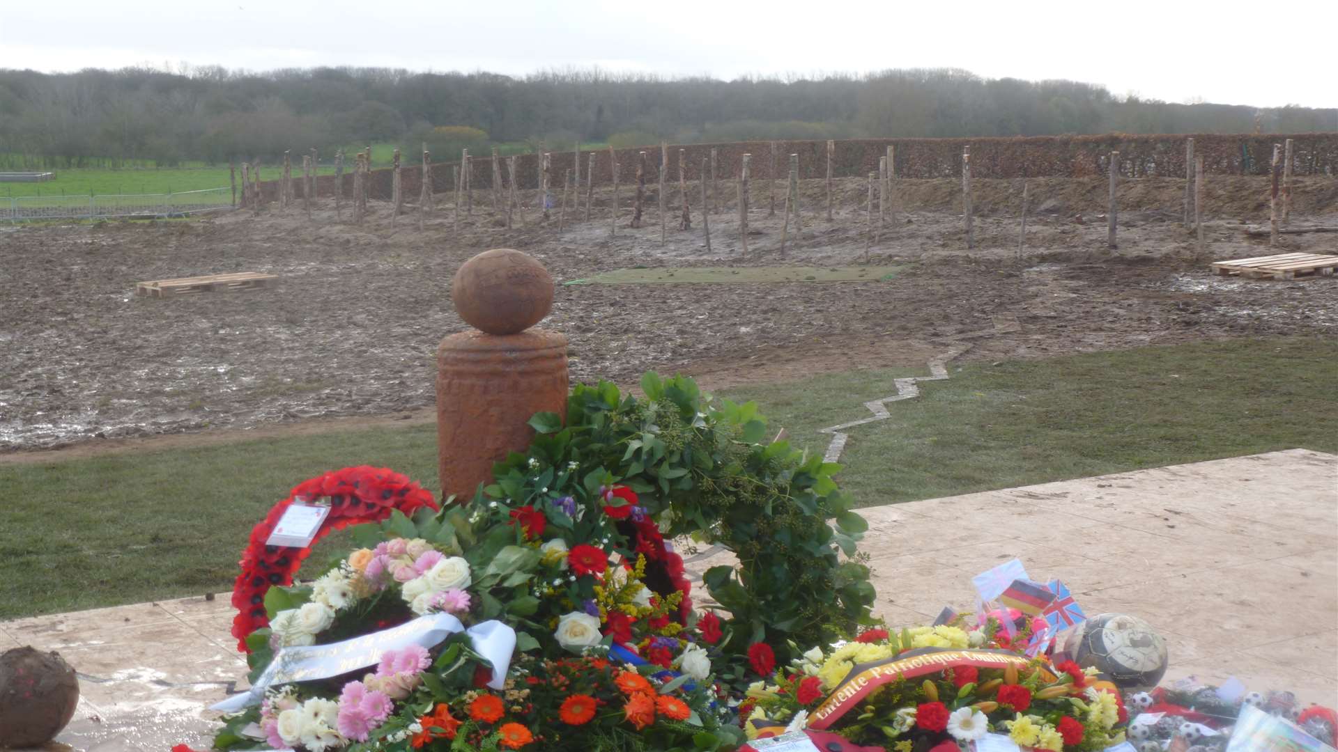 A new memorial to the Christmas Truce football match in Comines-Warneton including an old-fashioned ball on top of a German shell dug out of the ground