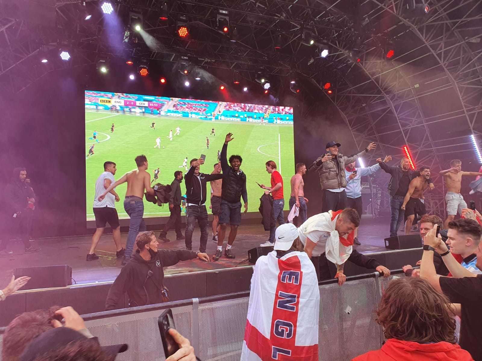 Fans climbed railings to get on the stage after England doubled their lead against Germany