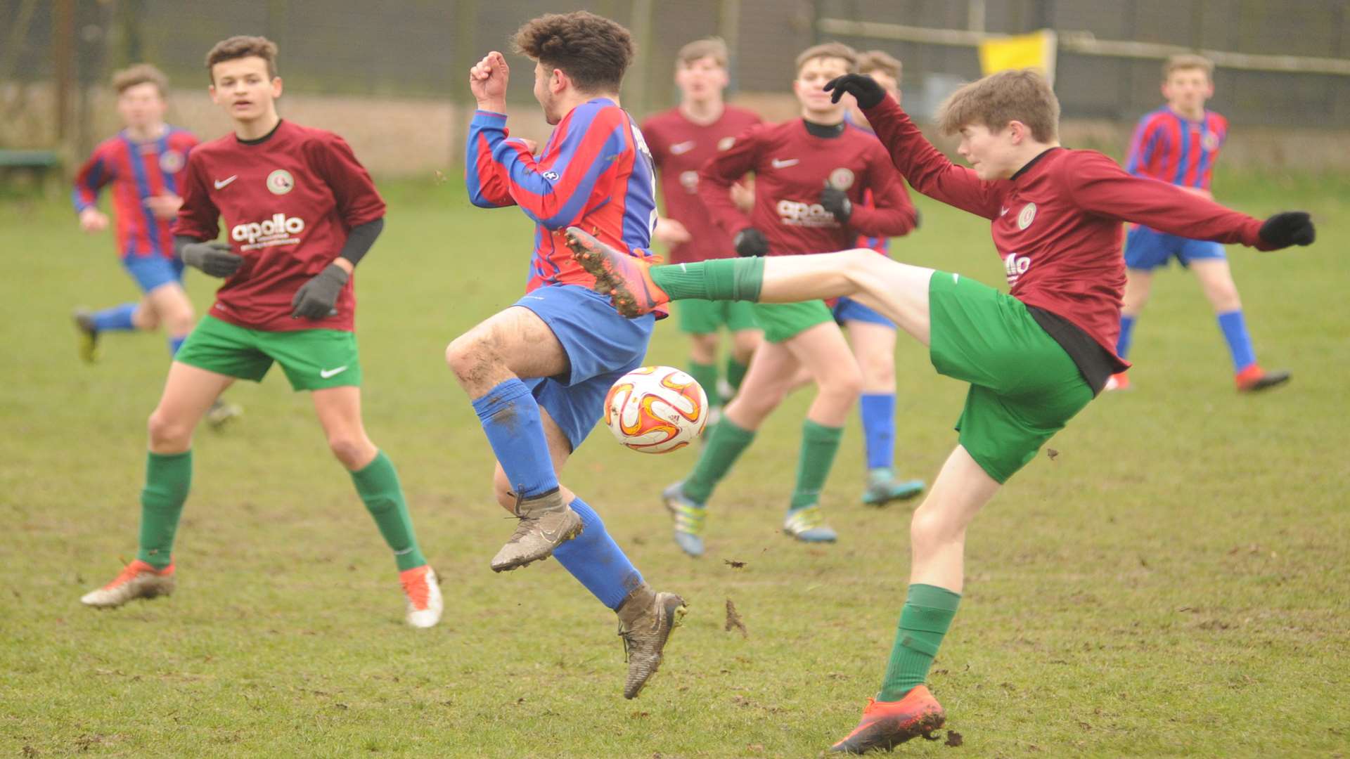 Cobham Colts under-16s (red and green) and Woodpecker HI get stuck in Picture: Steve Crispe