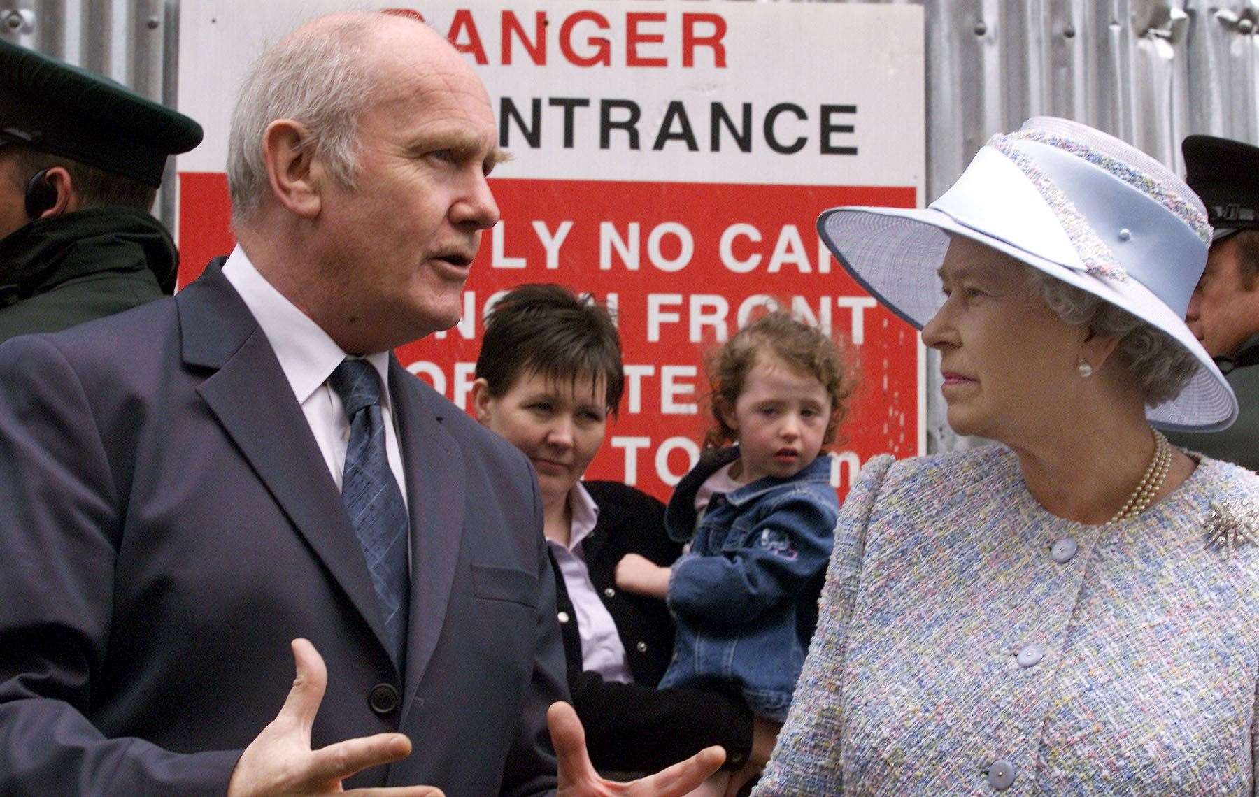 Northern Ireland secretary John Reid shows Queen Elizabeth II the site of the Omagh bombing during a visit to the County Tyrone town in 2002 (PA)