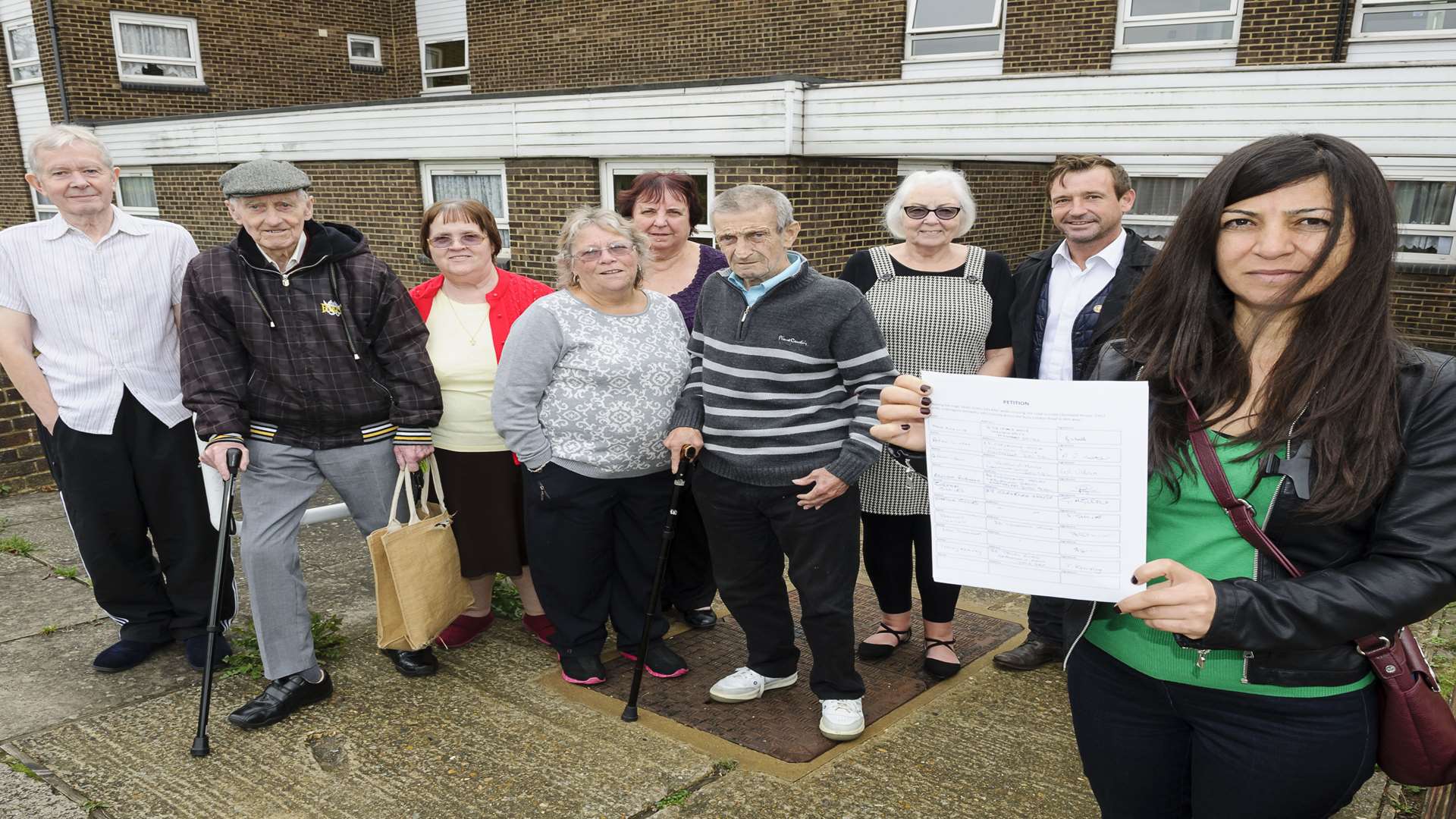 Petition organiser Pakize Guvenc, front, with Peter Scollard, right and residents of Cleveland House.