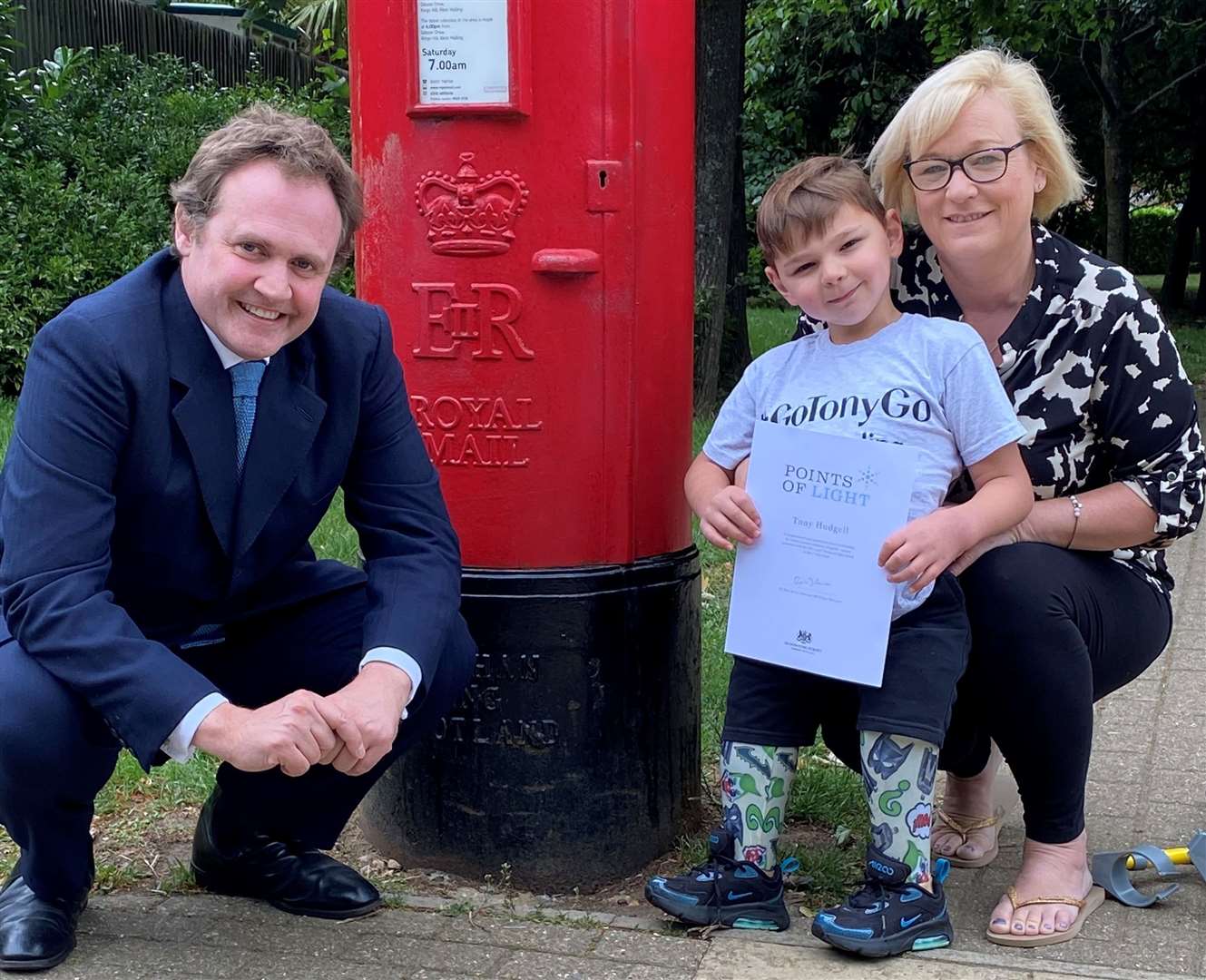 MP Tom Tugendhat with Tony Hudgell and his mum Paula