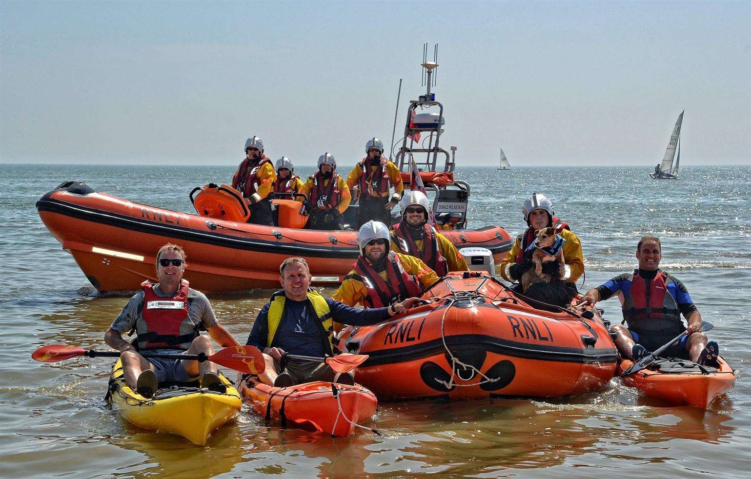 (L-r in Kayaks) Iain Emmerson, David Herriott and James Tritton prepare for their kayaking challenges in aid of the RNLI while Harvey the Jack Russell has a ride in Walmer Lifeboat's RIB.