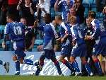 Darren Byfield and his Gills team-mates celebrate the late winner. Picture: GRANT FALVEY