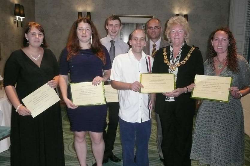 Mark Isden (centre) receives the top prize from Mayor Cllr Ronnie Philpott, with Debbie Everett, Amy Howie, Ian Abraham, Town Team chairman John Angell, and Susan Proudfoot.