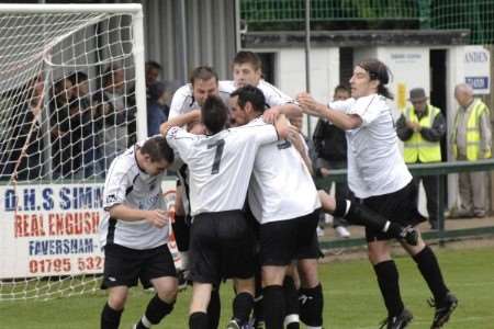 Town's players mob Lee Shearer after his winner against Norton on Saturday