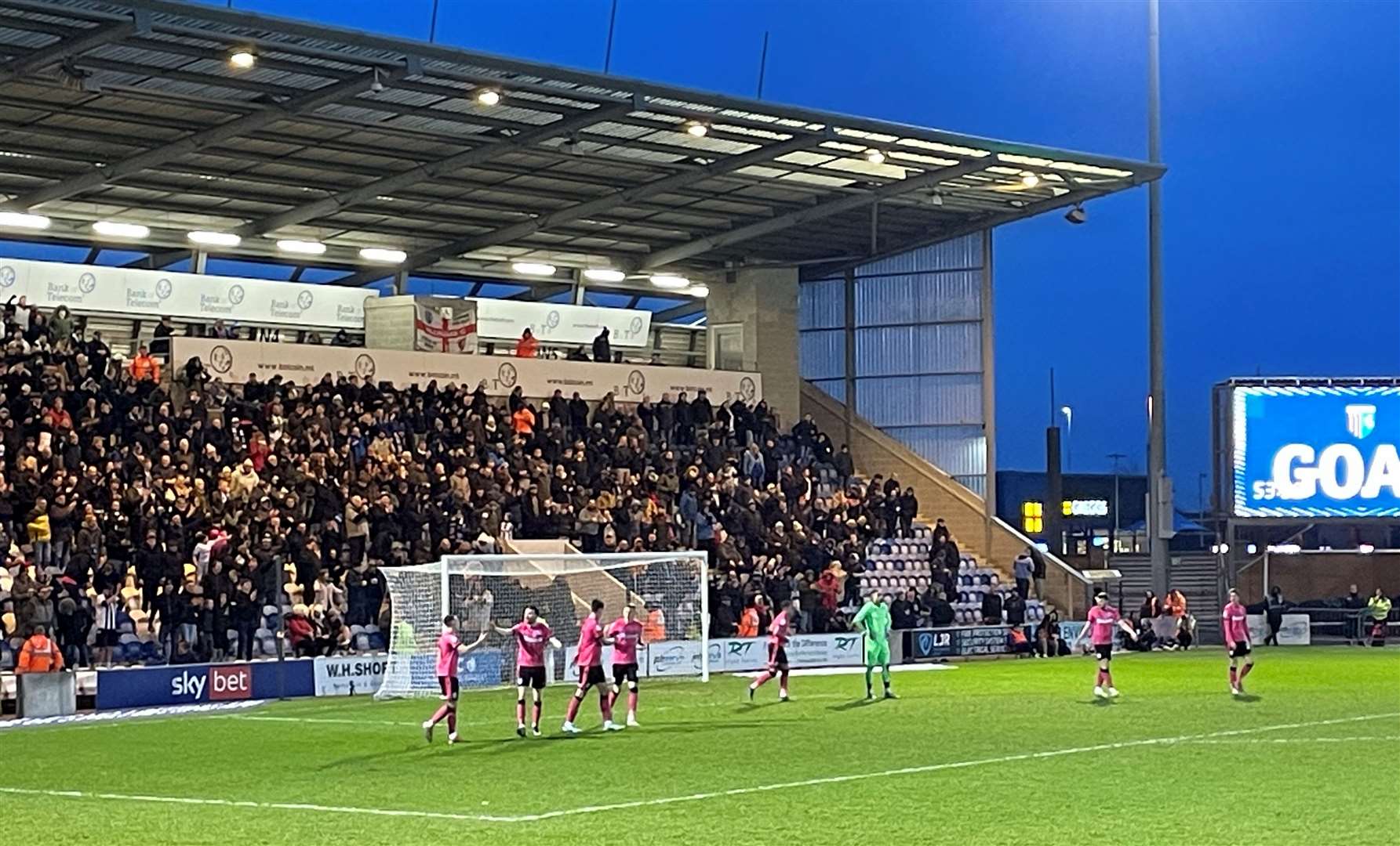 Gillingham fans watch their team win at Colchester United on New Year's Day