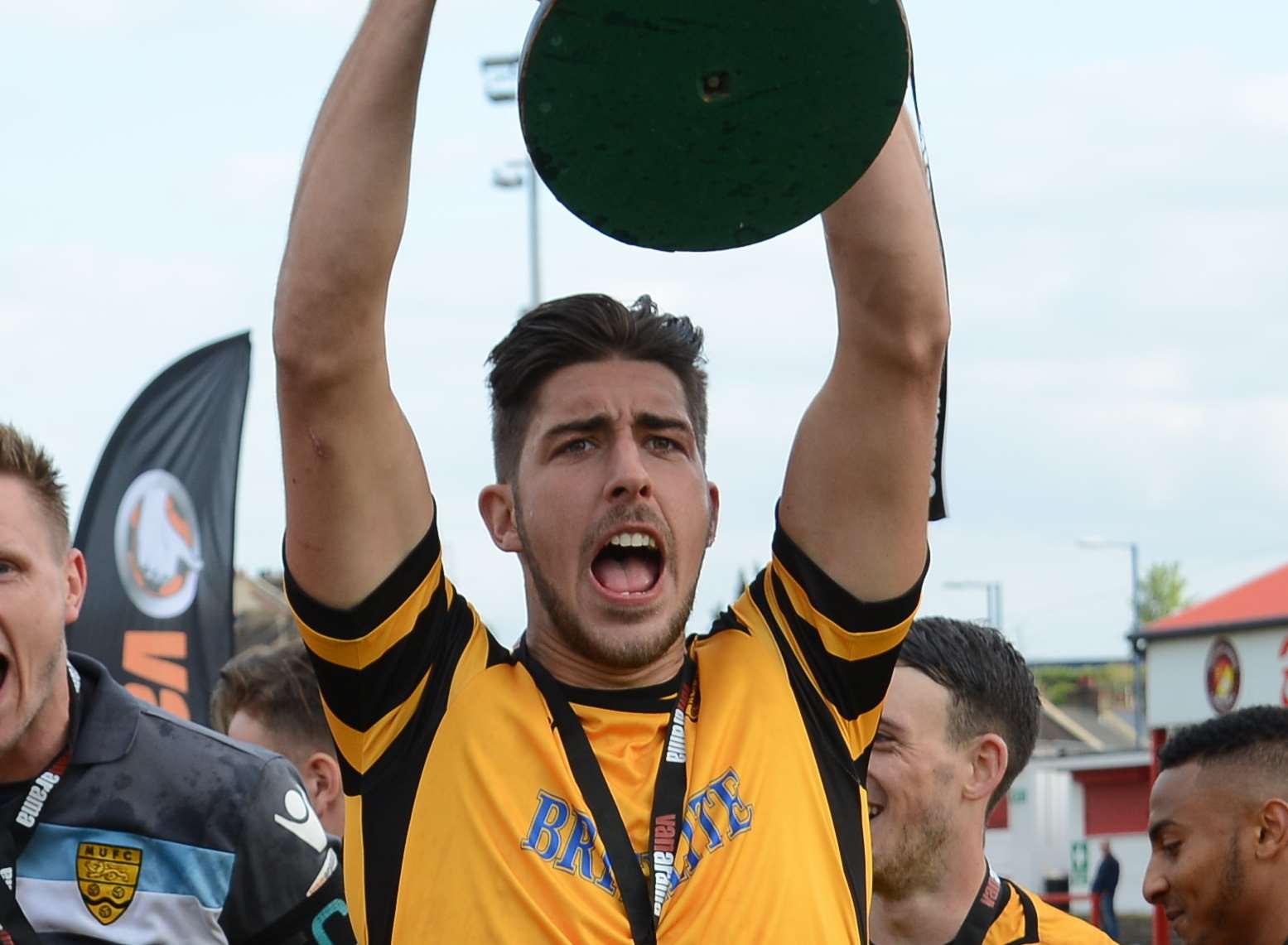 Dan Sweeney lifts the play-off trophy Picture: Gary Browne