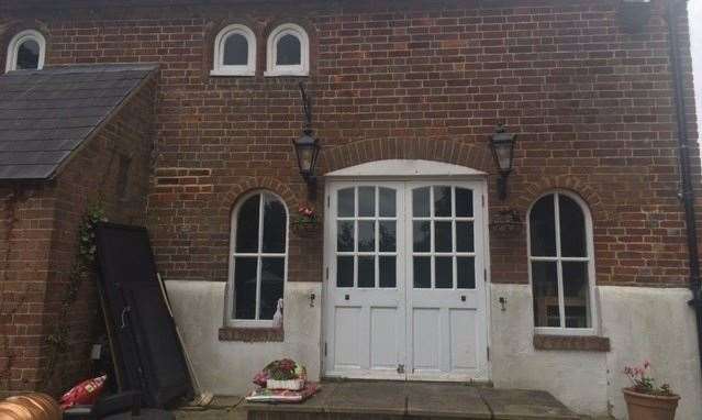 The arched windows from the front of this 15th Century coaching house are also a feature at the back of the pub