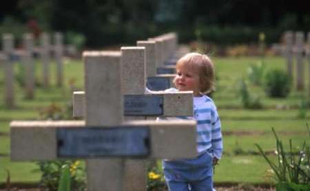 A young visitor at one of the many battlefield cemeteries