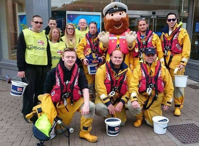 The RNLI volunteers collecting cash from residents on Saturday