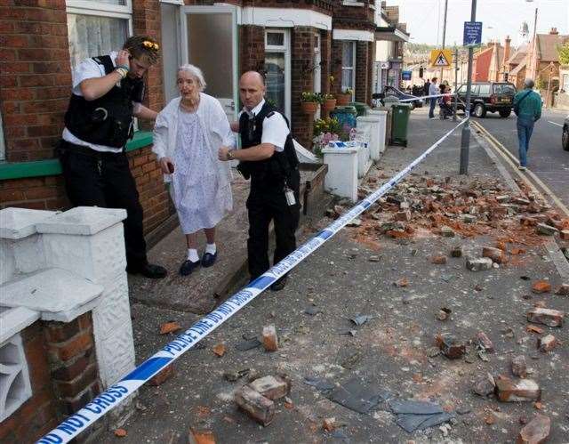 A woman is led to safety after the Folkestone earthquake of 2007. Picture: Edward Thompson
