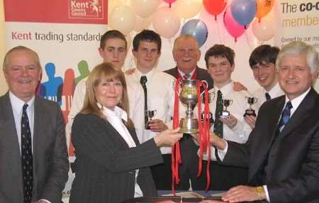 TRIUMPH: The winning students with KCC cabinet member for community services Mike Hill, Sandra Cook from Kent Trading Standards, KCC chairman Fred Wood-Brignall and KCC director of community safety and regulatory services Clive Bainbridge