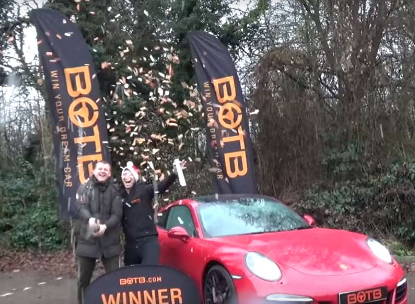 Tom Harvey (left), of Bean, scooped a Porsche 911 and £20,000 after entering a competition.