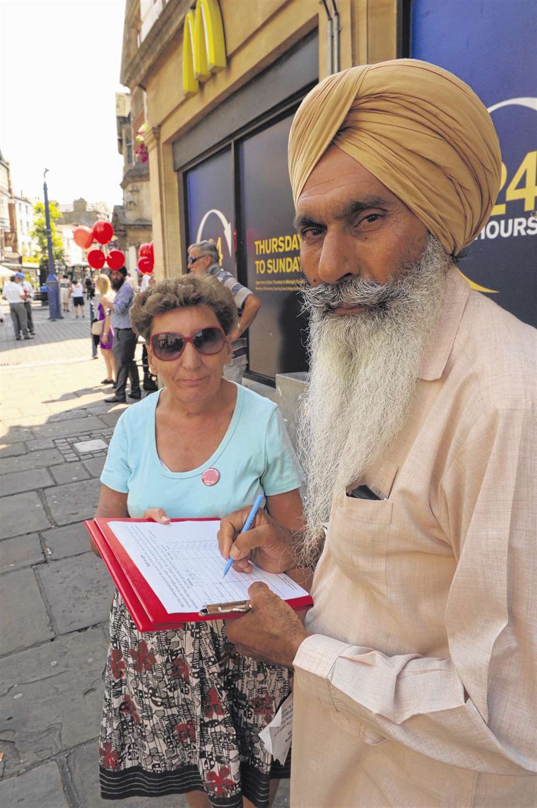Cllr Pam Sales and Chhinda Singh with the petition