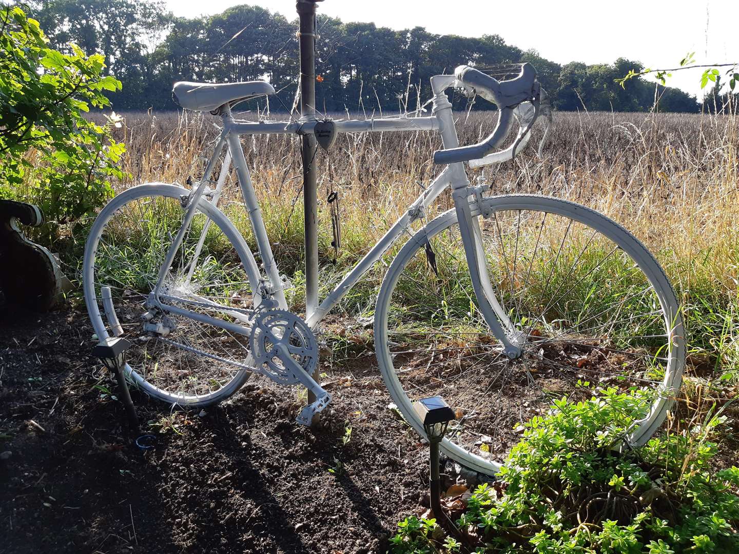 The ghost bike and flower beds are a reminder to drivers of the A258 Deal to Dover Road to watch out for cyclists