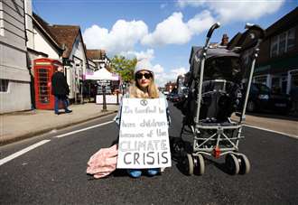 Lone woman stops traffic for climate campaign