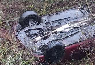 Carer feared she’d be trapped after car flipped into ditch