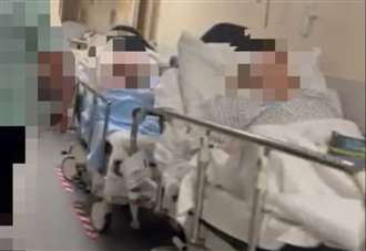 NHS 'on its knees' as footage shows patients lining corridors