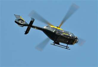 Police helicopter in search for 'armed men'