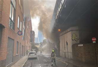 Around 70 firefighters tackle blaze near key commuter station