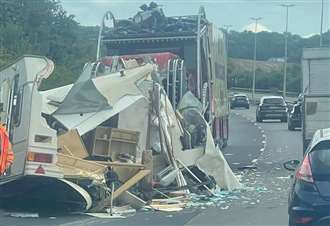 Caravan destroyed in crash on A road