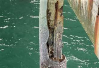 Worrying pictures show popular pier's legs rusting away