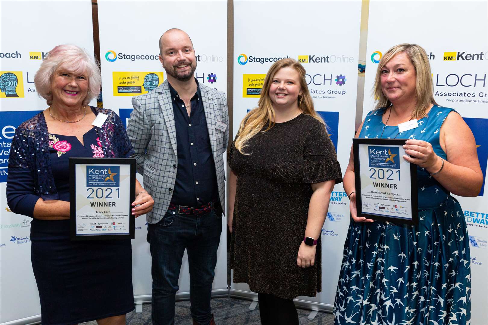 Richard Archer and Katie Weaver of Cactus Graphics presents awards to Tracy Carr of Talk It Out (left) and Dawn Foulkes of Dover smART Project (right)