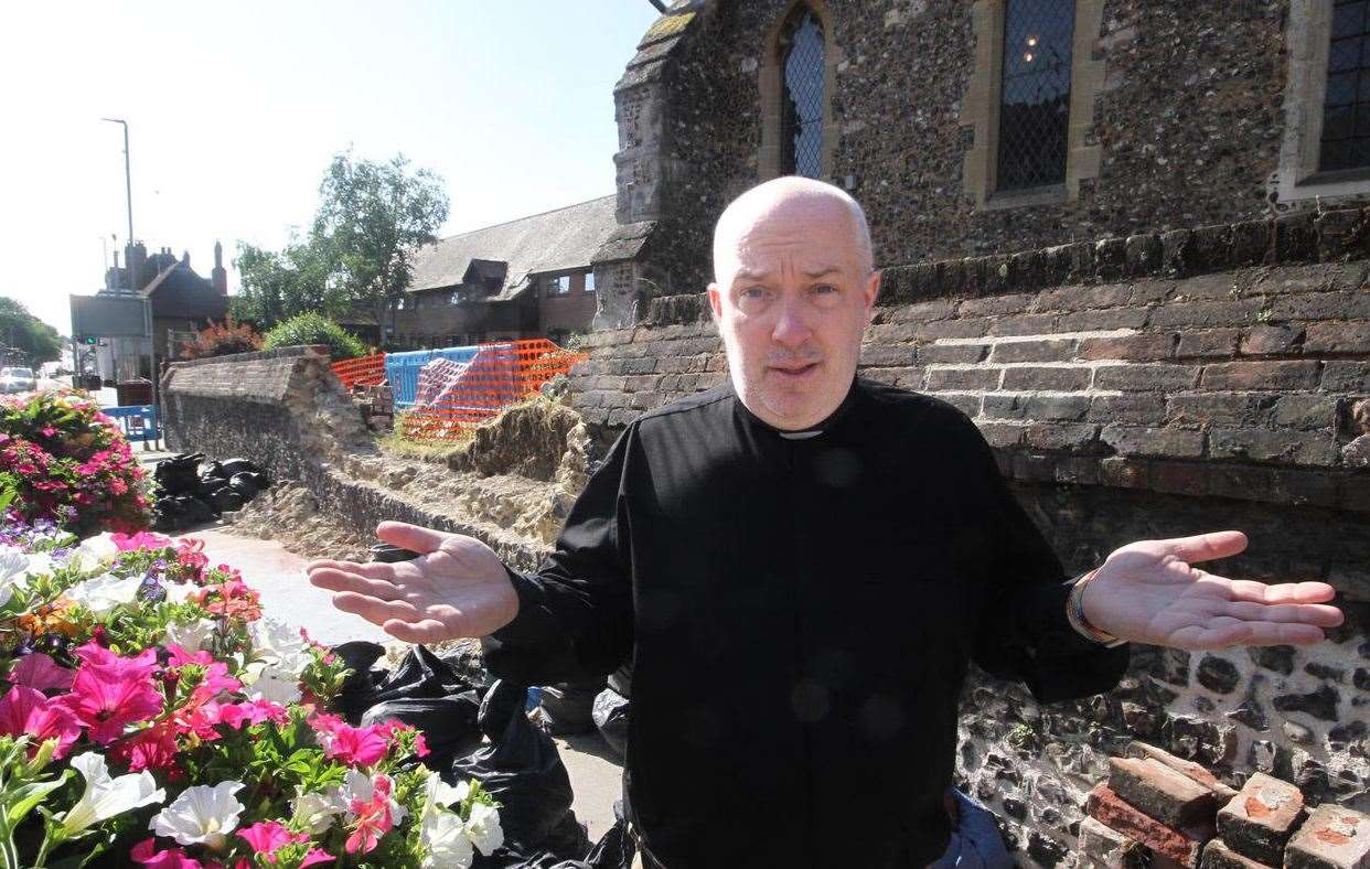 The Rev Nathan Ward is frustrated about a £73,000 repair bill for the church wall. Picture: Roger Vaughan