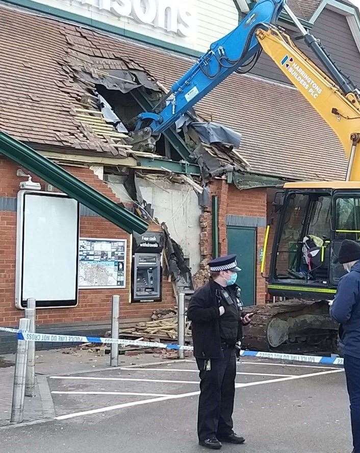 Police at the scene of the raid at the Morrisions store in Northfleet in January this year