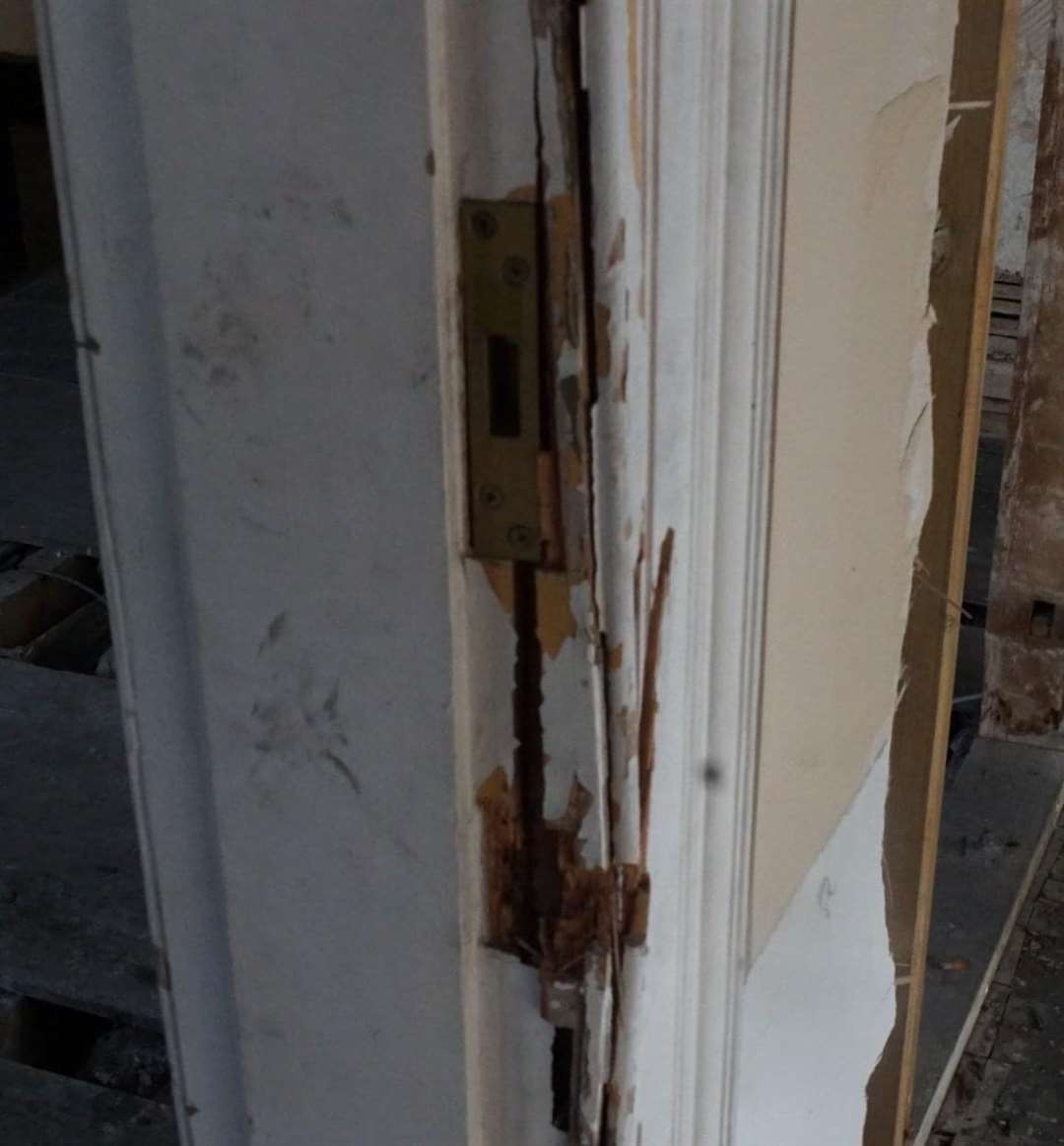 Doors were severely damaged during a police raid in May 2012. Picture: Stone Court House Facebook
