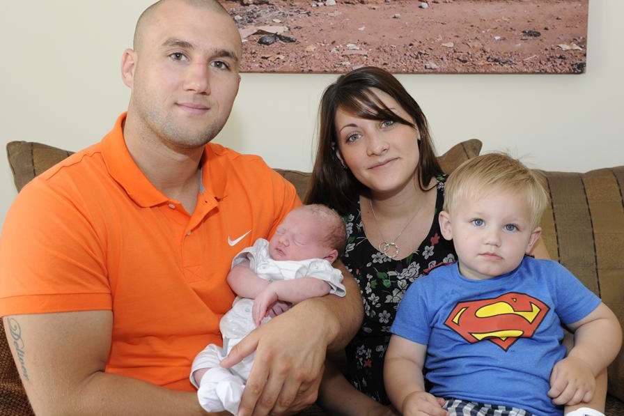 Joe and Hannah Cooper, one year old Charlie Cooper and new baby George Cooper