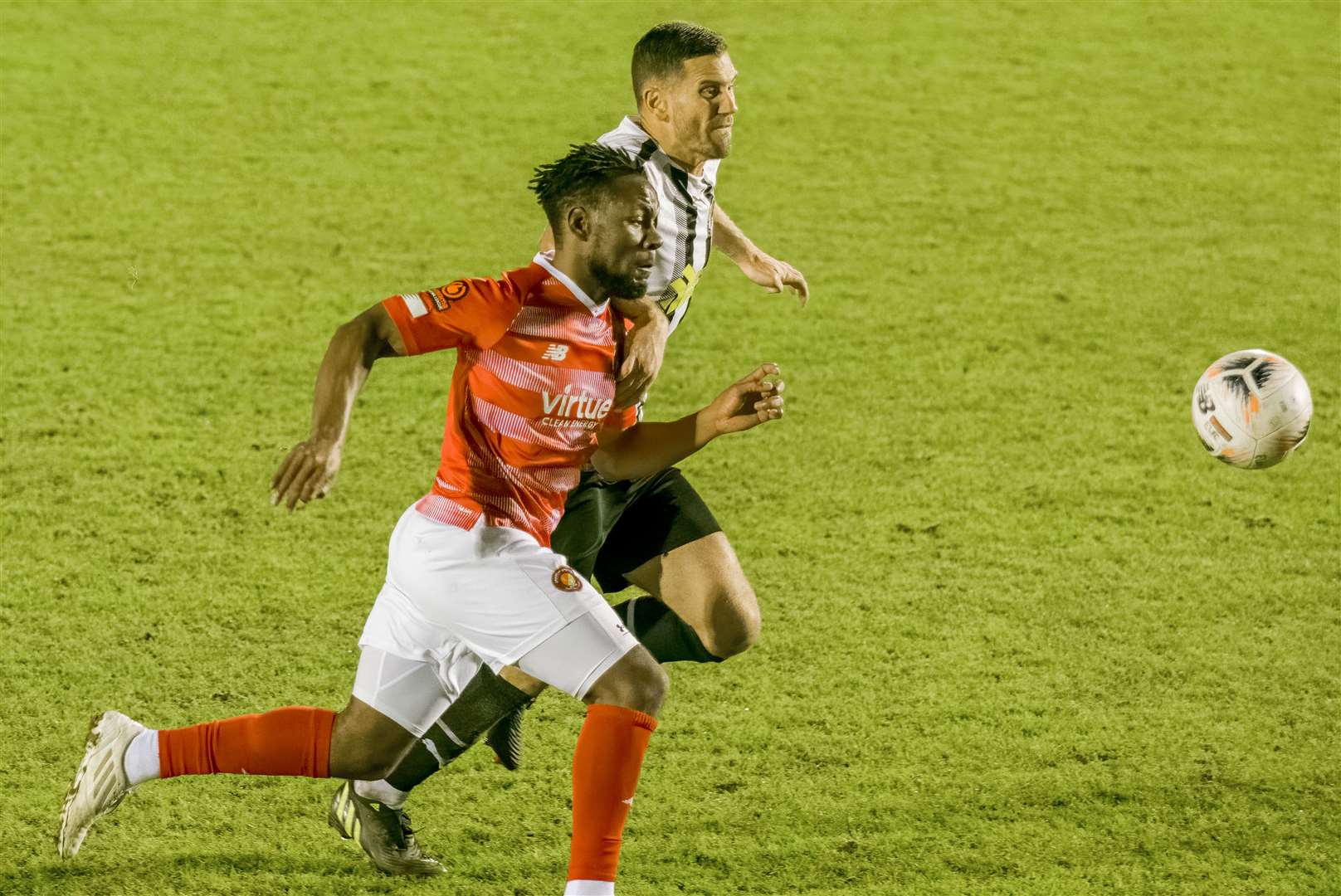 Dartford's Tom Bonner races Ebbsfleet's Shaq Coulthirst to the ball on Boxing Day. Picture: Ed Miller/EUFC