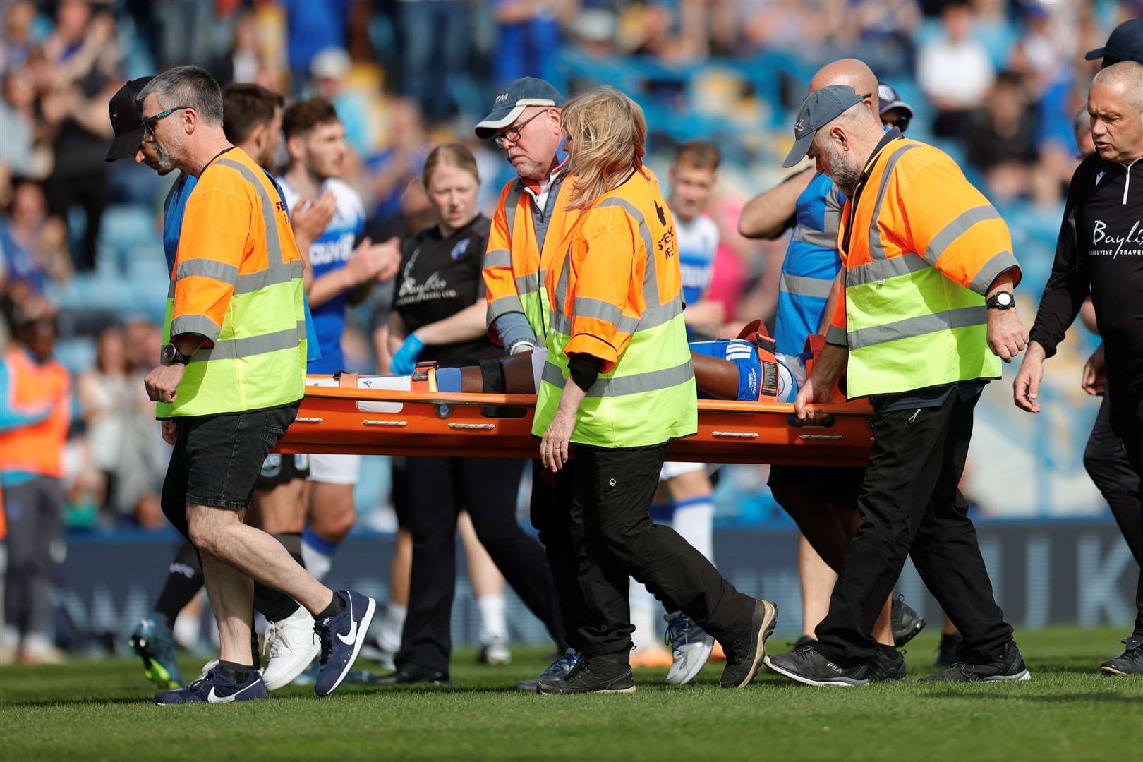 Josh Walker is taken off injured in Gillingham's match against Barrow Picture: @KPI_Julian