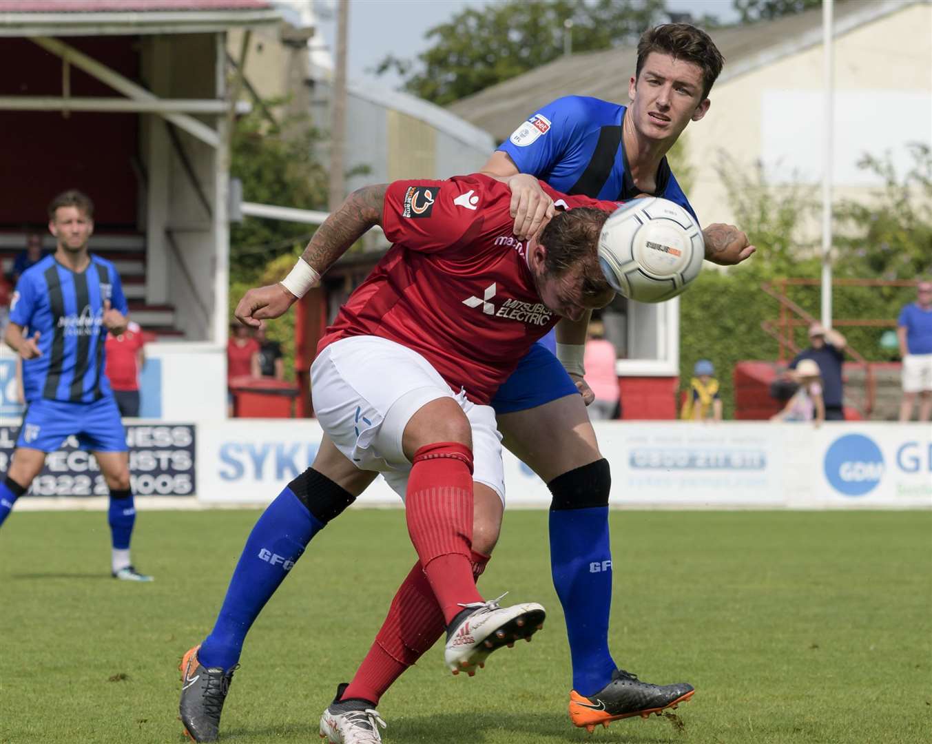 Alex Lacey get to grips with ex-Gill Danny Kedwell on Saturday Picture: Andy Payton