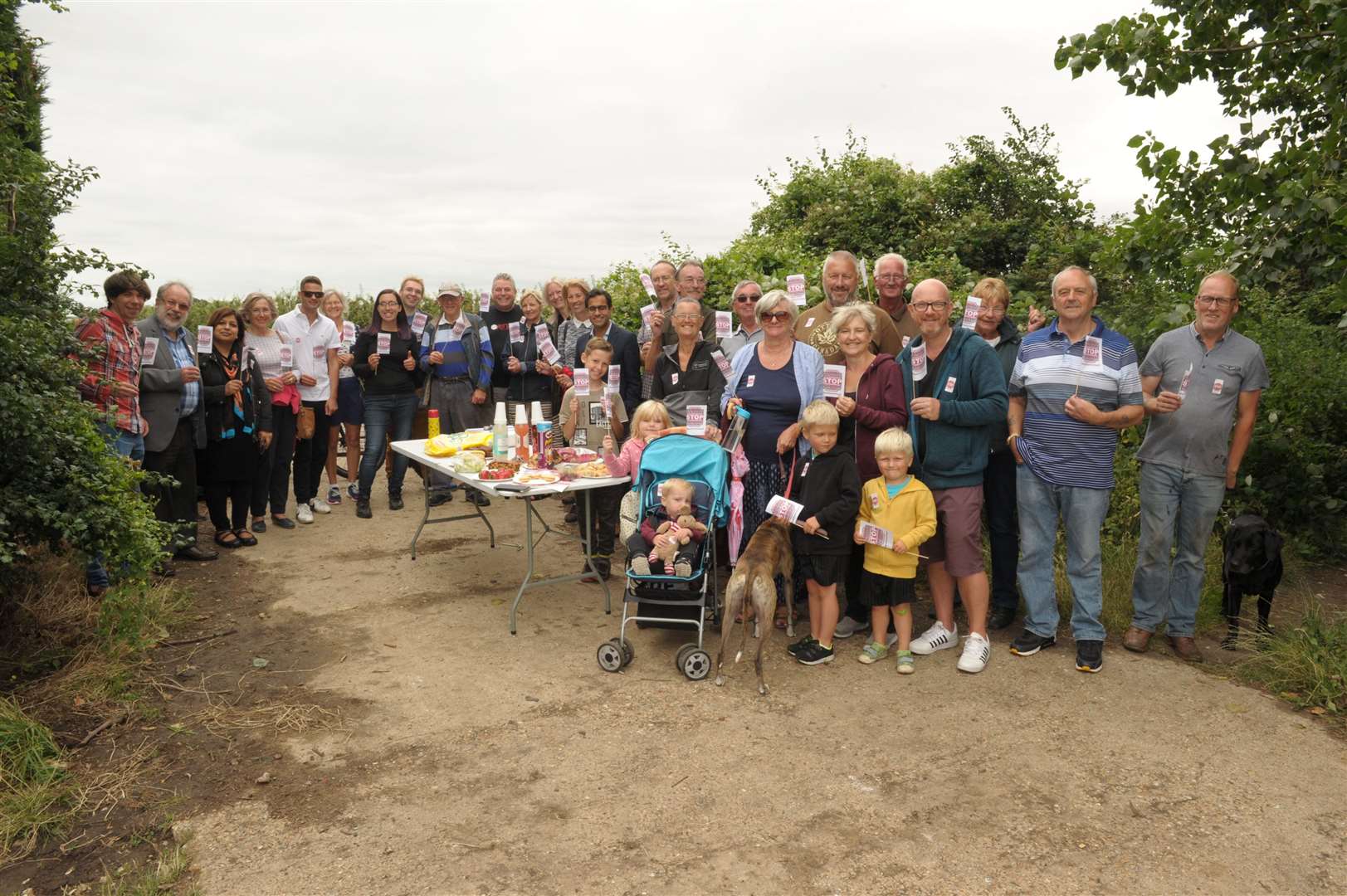 Around 60 people went to the orchard between Pump Lane and Lower Bloors Lane to protest against housing development plans. Picture: Steve Crispe. (14405227)