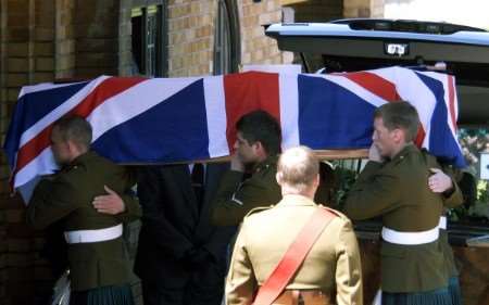 L Cpl James Johnson's coffin is carried into the crematorium by fellow soldiers. Pictures: Barry Duffield