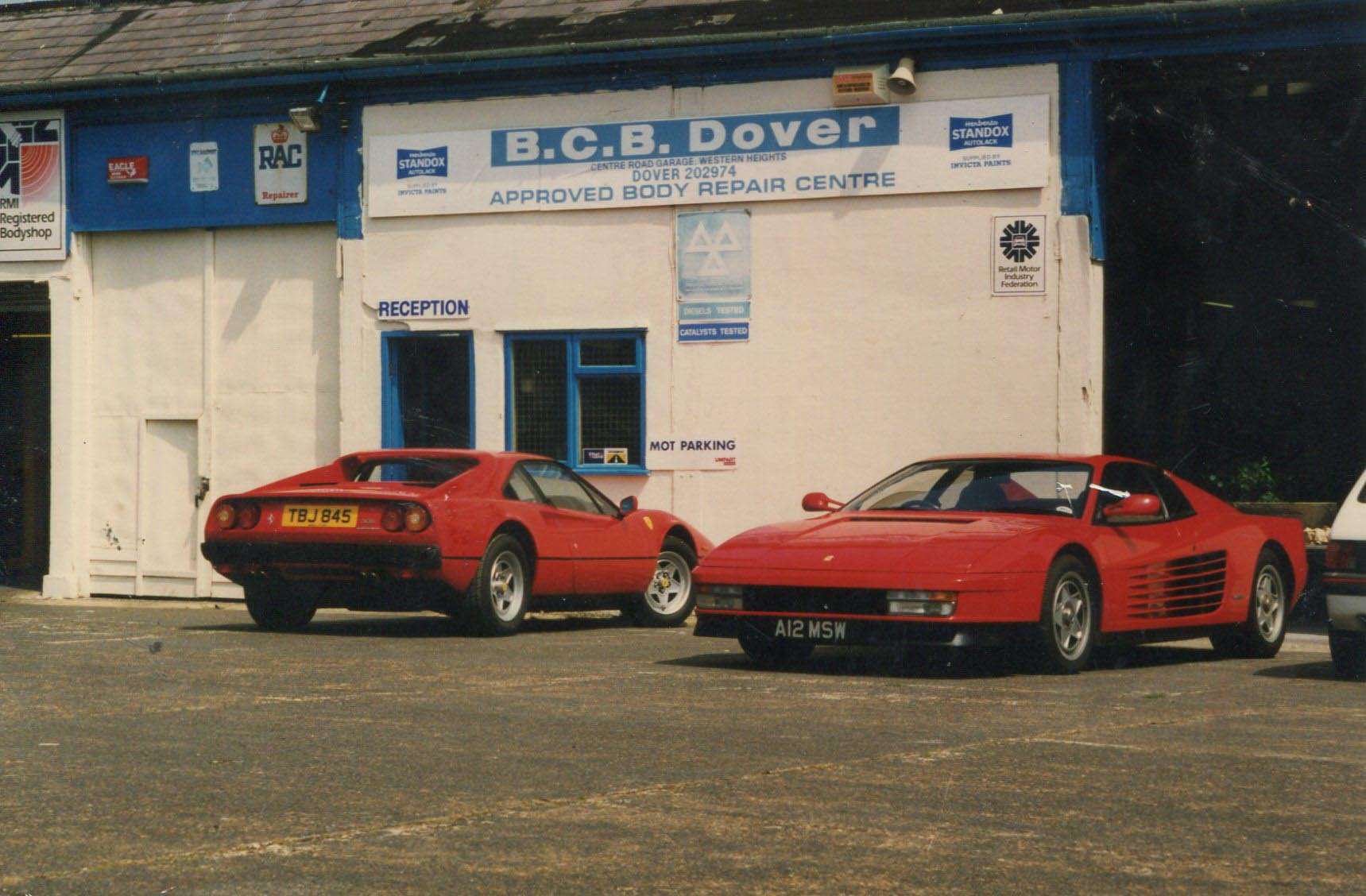 Two Ferraris outside the garage