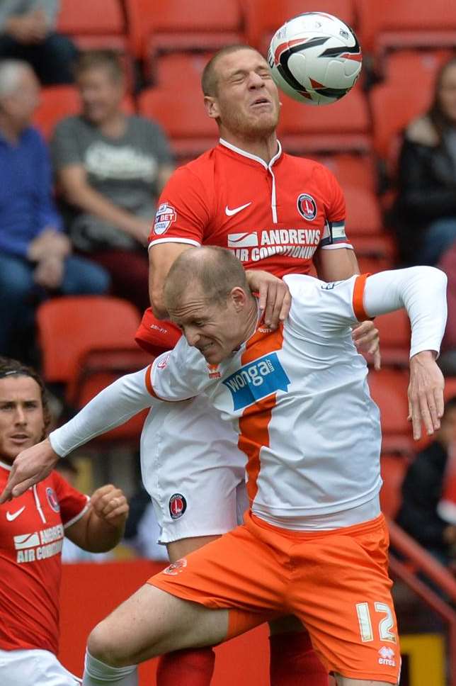 Michael Morrison wins this aerial battle against Blackpool on Saturday. Picture: Keith Gillard