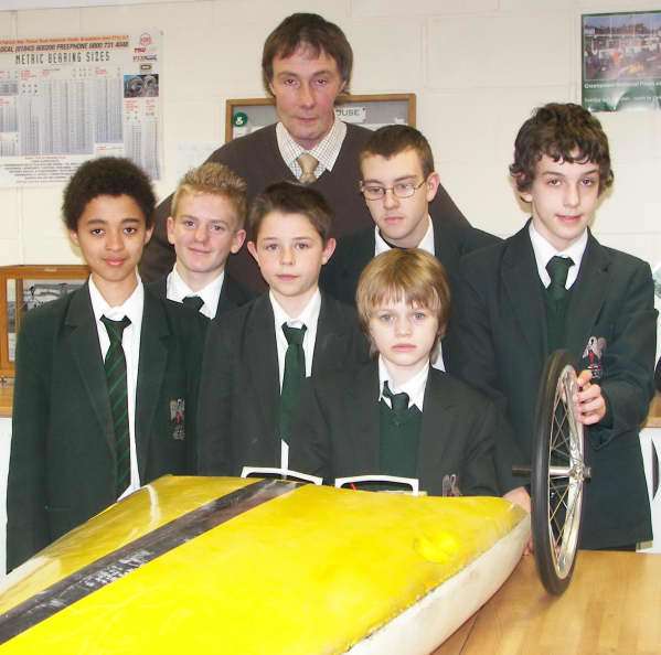 Team leader Lester Edmeades and the Chatham House School boys with the shell of their "racing car"