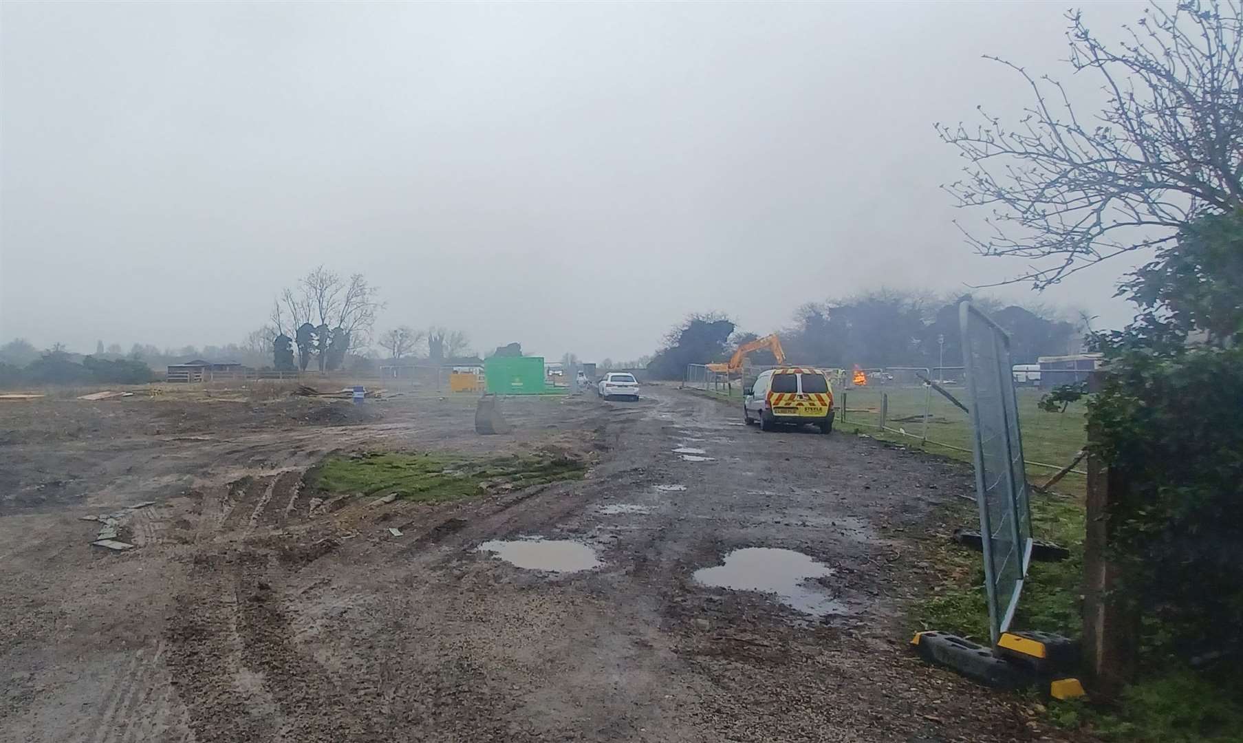 There was smoke billowing from a bonfire as work continued to clear the site