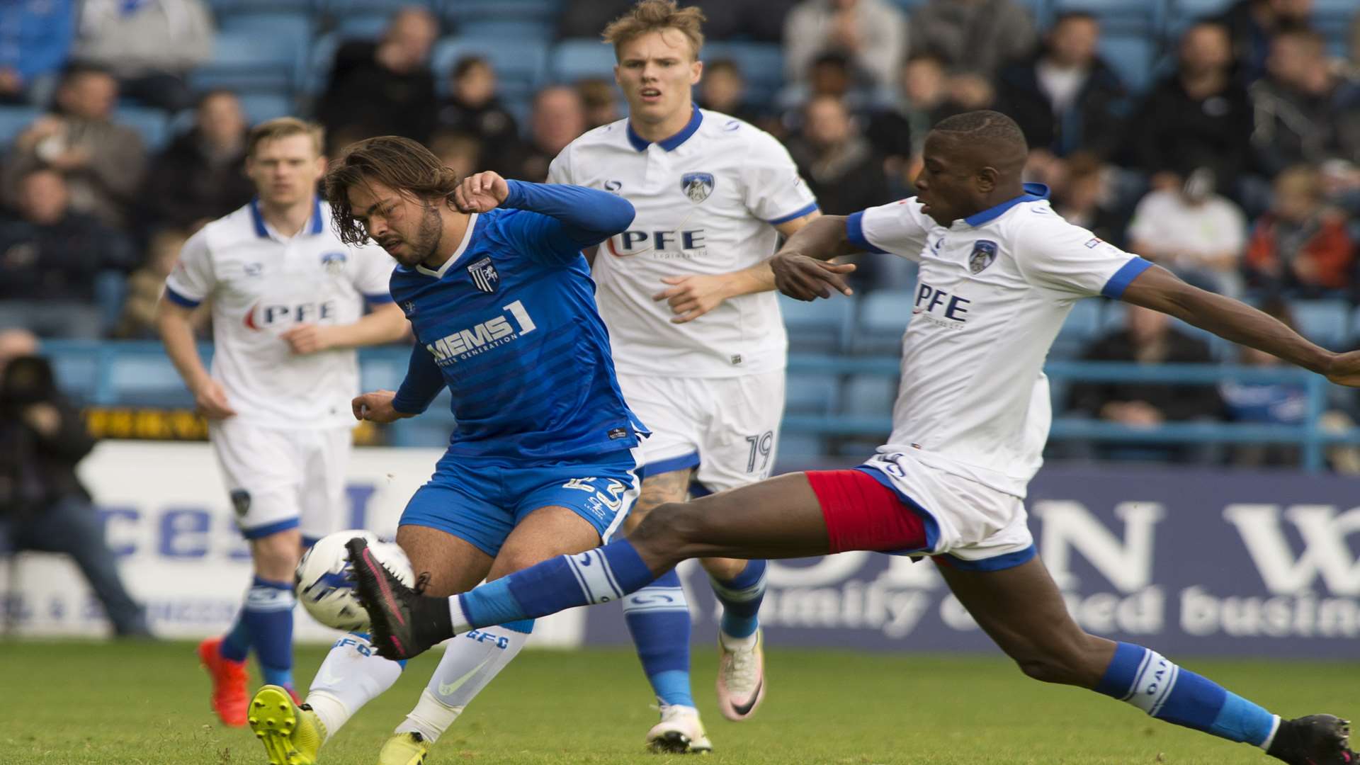 Oldham get a foot in to stop Bradley Dack Picture: Andy Payton