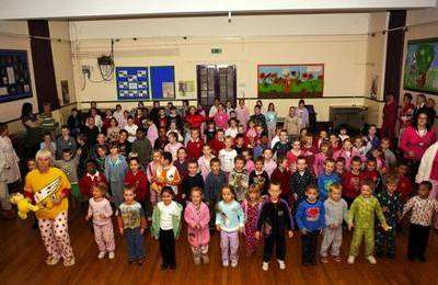 Staff, pupils and parents at St Philip Howard School, Herne Bay doing a sponsored "Wake Up and Shake Up" session in their pyjamas for Children In Need.