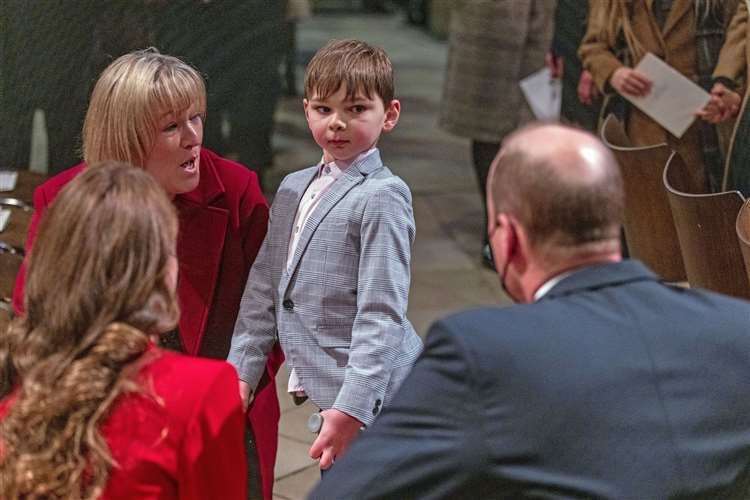 Tony Hudgell, then seven, with his mother Paula Hudgell, meeting the royal couple at a carol service at Westminster Abbey in 2021 (Heathcliff O’Malley/PA)