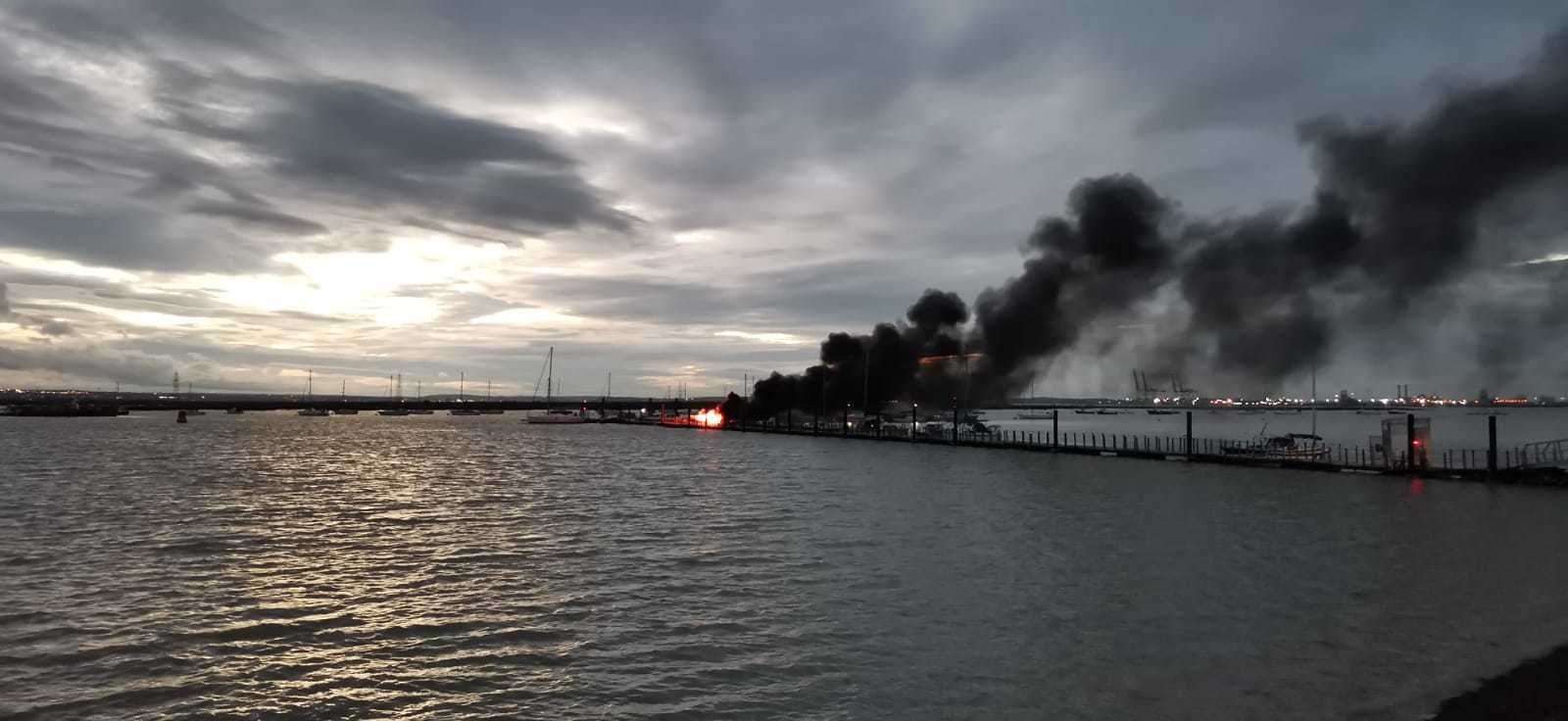Smoke billowing from the boat after it exploded at Queenborough marina. Picture: Dan Oliver