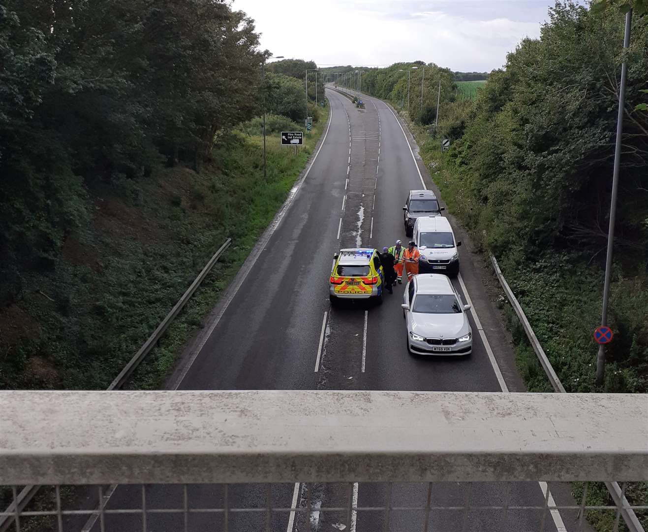 Police have blocked the road in either direction after the crash with the Dover Road bridge. Picture: Martin Harman