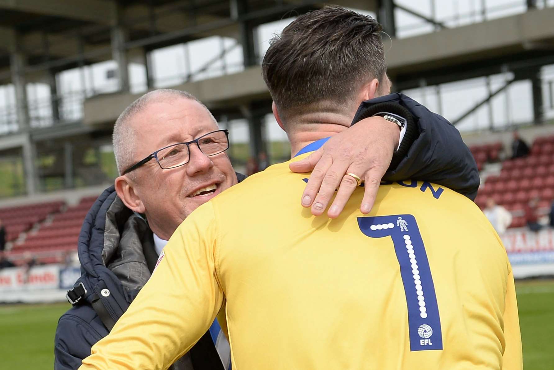 Chairman Paul Scally hugs keeper Stuart Nelson at full-time Picture: Ady Kerry